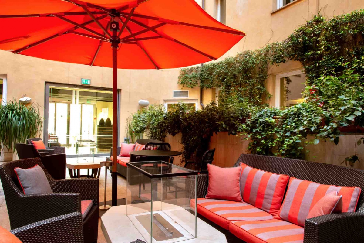 47 Boutique Hotel - Hotel internal courtyard with plants and comfortable seating.