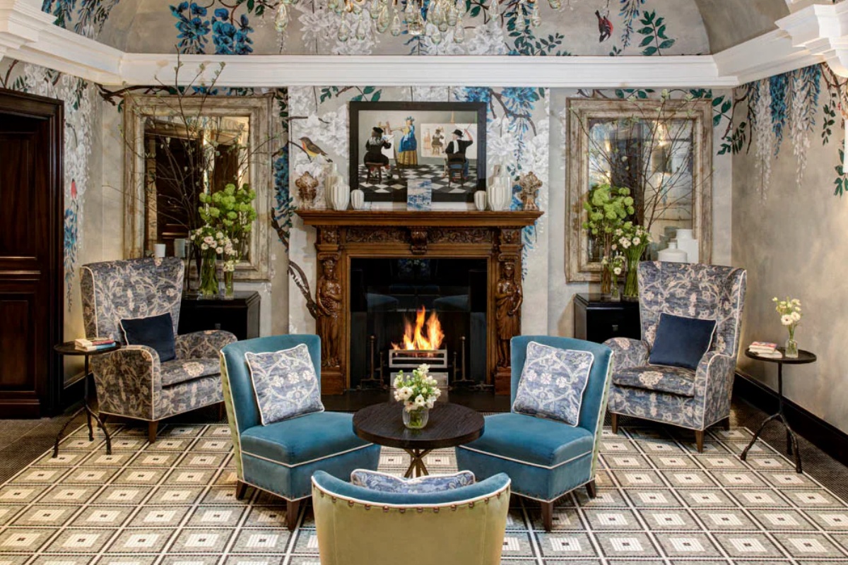 Brown's Hotel - a room with a fireplace and chairs