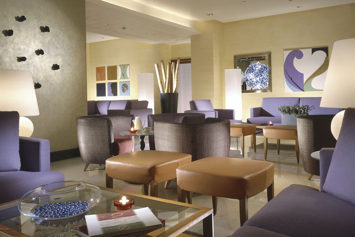 Capo D'Africa Hotel  Colosseo - Hotel lobby area with contemporary furnishings and decor.