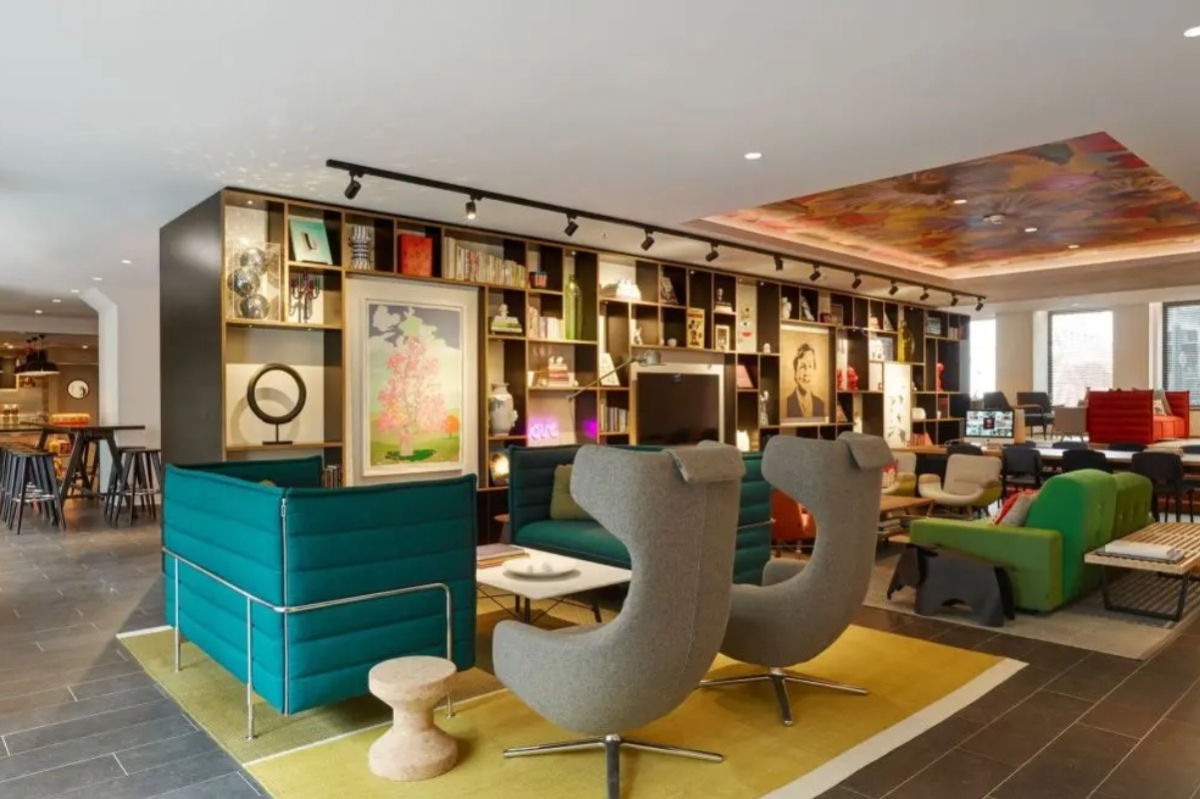 citizenM Amstel Amsterdam - a room with a couch and a table