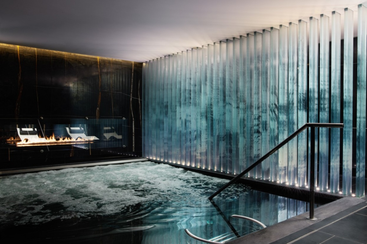 Corinthia Hotel - a person standing in a hot tub