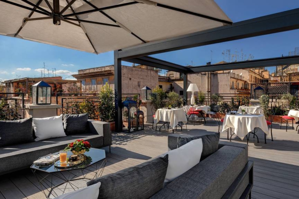 Dharma Boutique Hotel & Spa - The rooftop terrace lounge with a view of the Monti district.