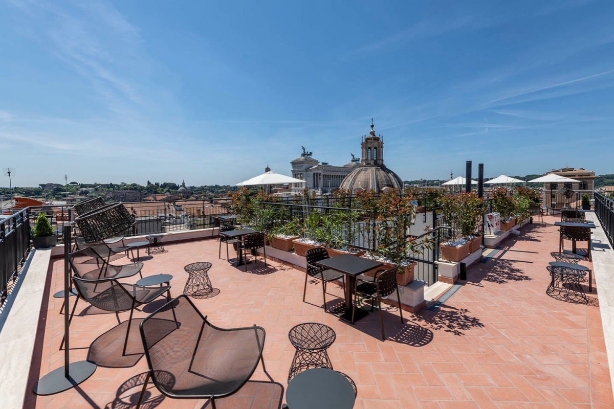 H10 Palazzo Galla - Rooftop terrace with panoramic views of the city.
