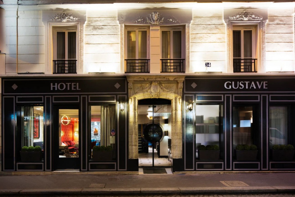 Hotel Gustave - a building with a sign on the front