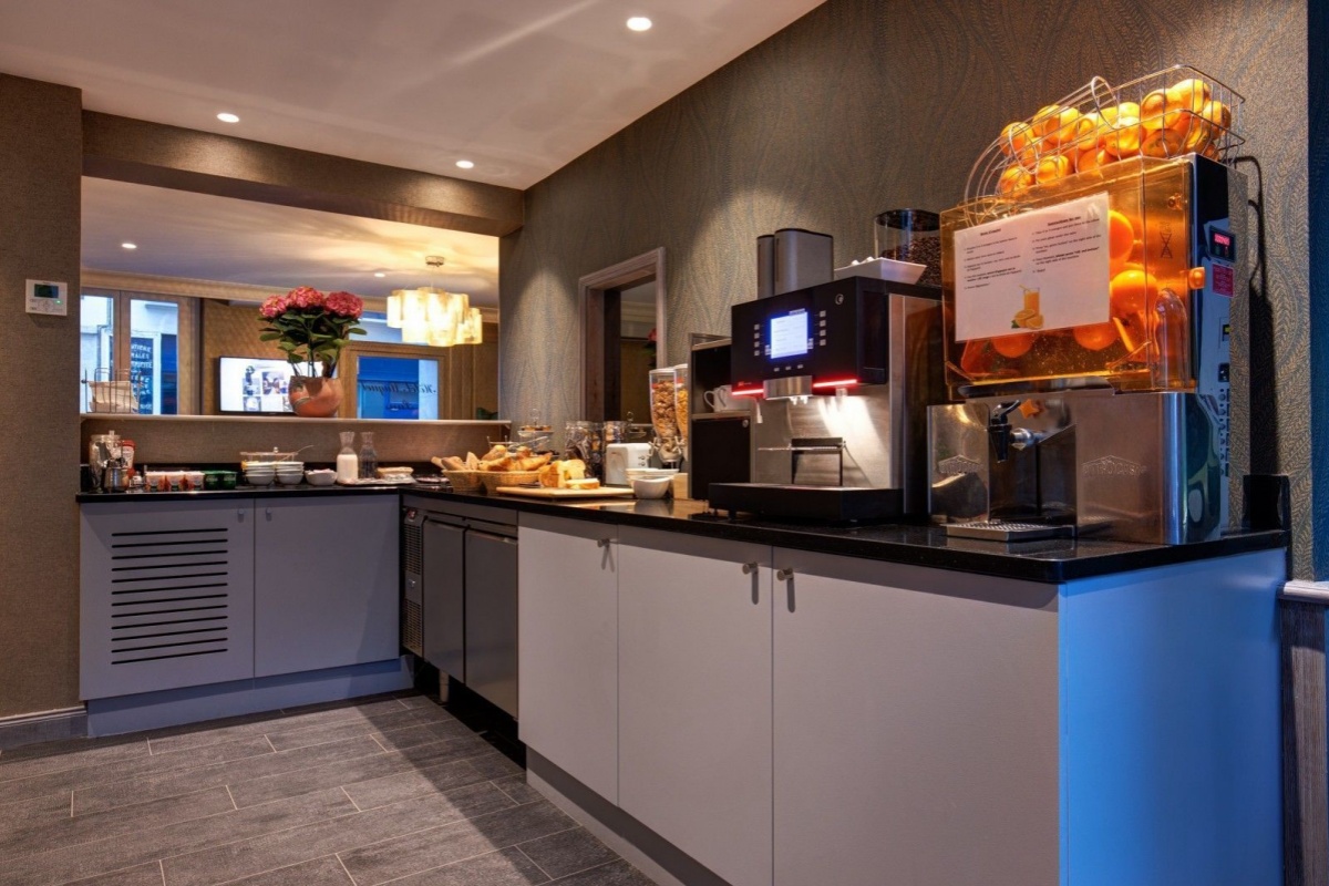 Hotel Muguet - a kitchen with a variety of food items