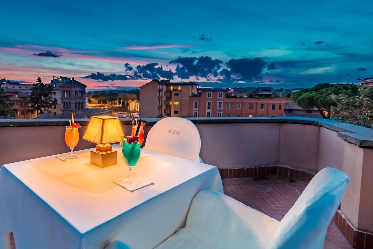 Kolbe Hotel Rome - Rooftop restaurant overlooking Rome at night time