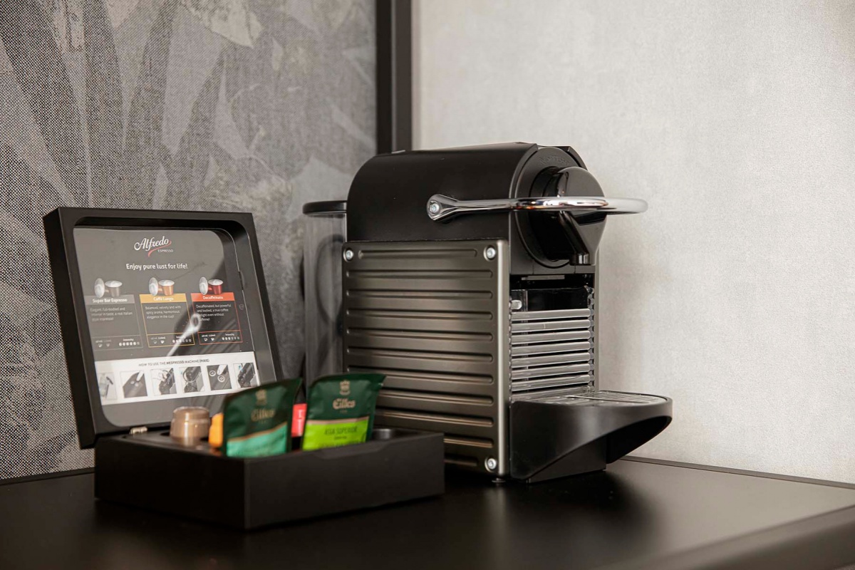 Krisotel - a coffee machine and a tray of tea