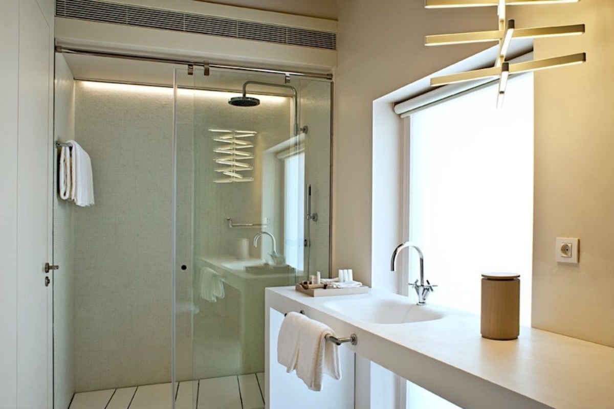 Mercer Hotel Barcelona - a bathroom with a shower and sink