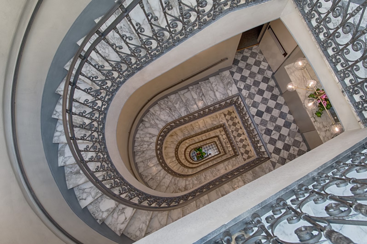 NH Collection Roma Fori Imperiali - Looking down the hotel's spiral staircase.