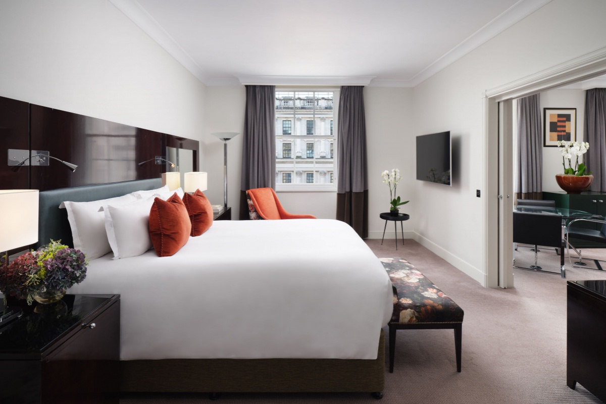 Sofitel London St James - a bedroom with a bed and a tv