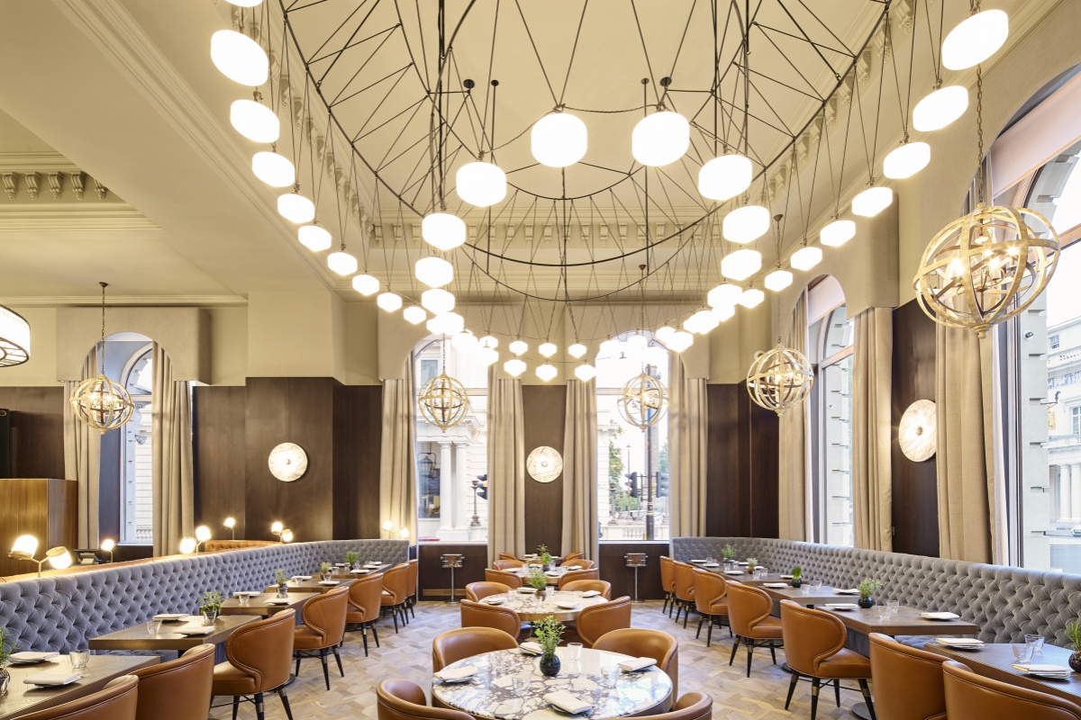 Sofitel London St James - a restaurant with tables and chairs