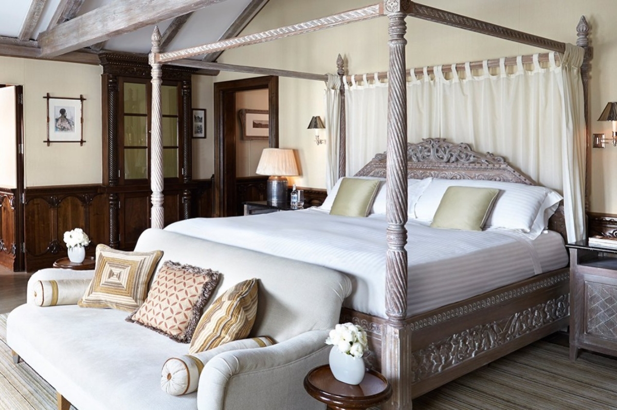 The Connaught - a bed with a four poster bed