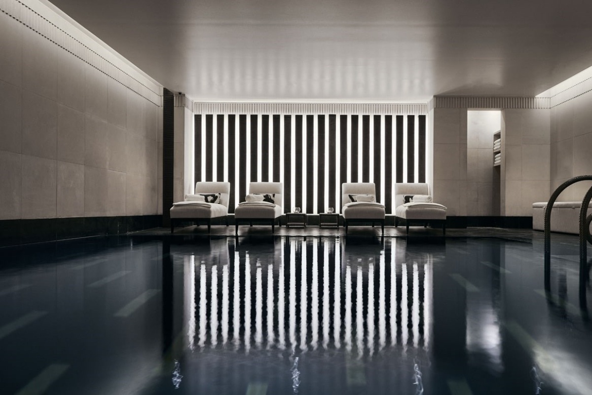 The Connaught - a pool with chairs in the middle
