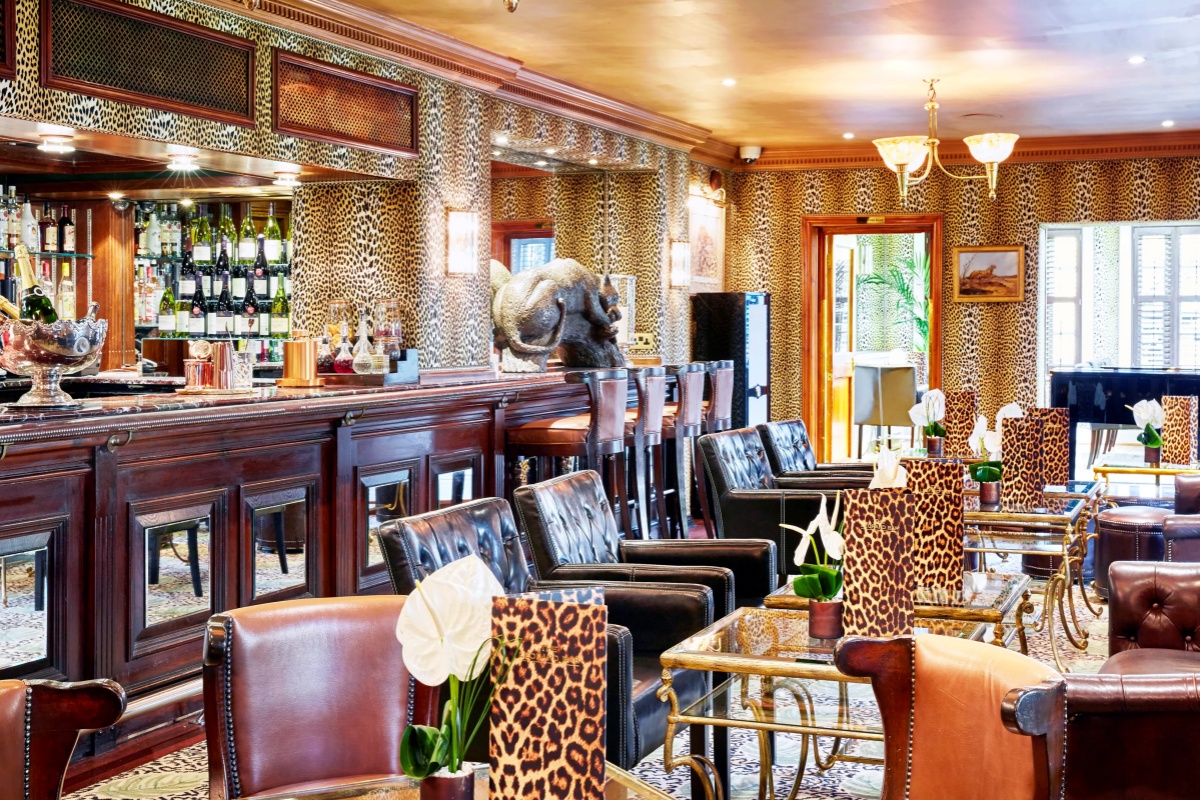 The Montague on The Gardens - a room with leopard print walls and chairs