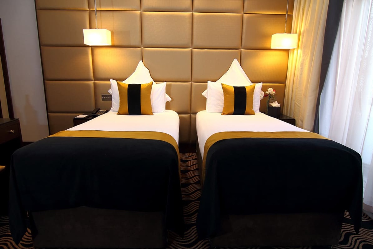 The Piccadilly London West End - two beds with black and gold pillows