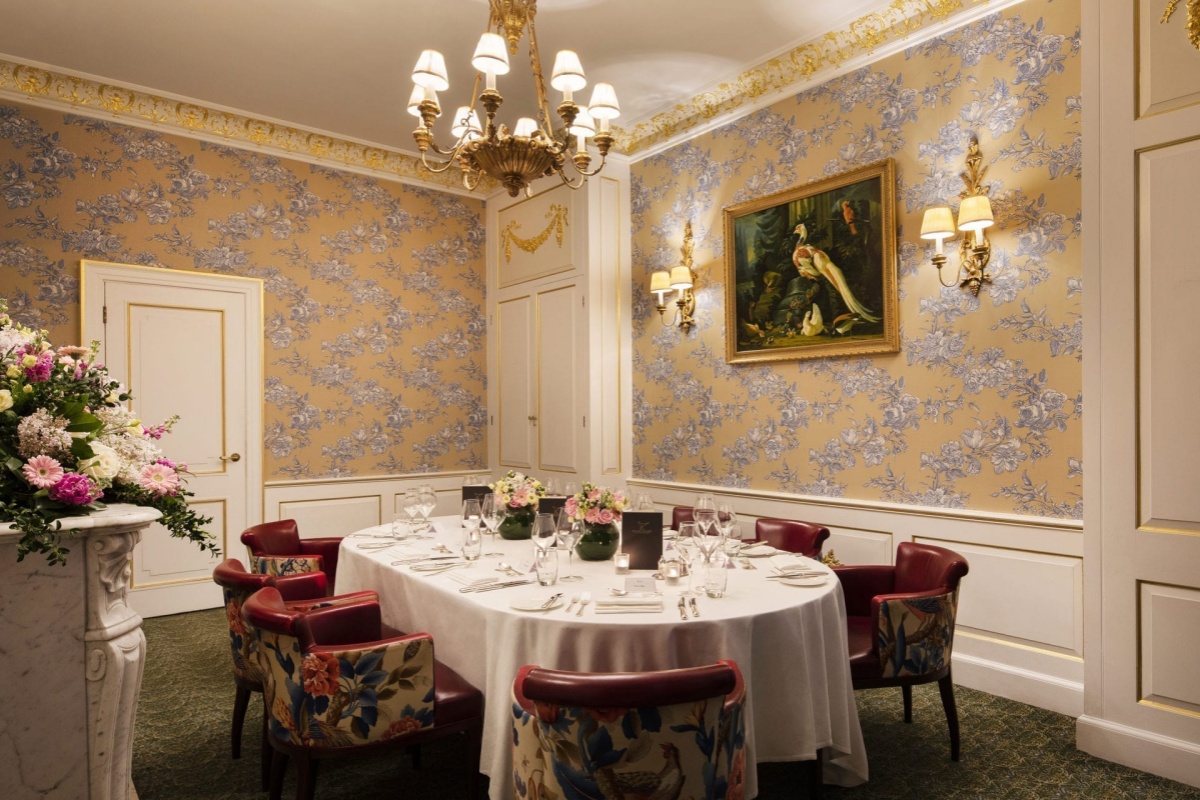 The Stafford London - a room with a table set for a dinner