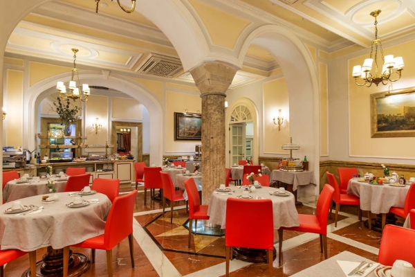 Albergo del Senato - a room with tables and chairs