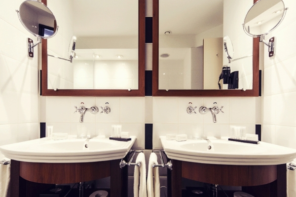 Banks Mansion - a bathroom with two sinks and mirrors