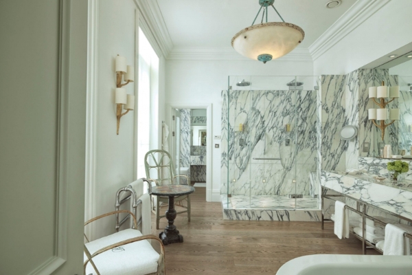 Brown's Hotel - a bathroom with marble shower and a tub