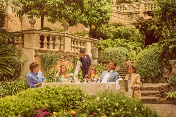 Brown's Hotel - a group of people sitting at a table outside