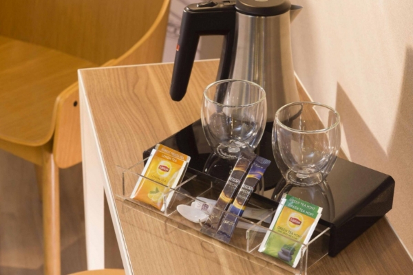 Cler Hotel - a tea pot and cups on a table