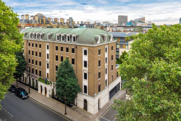 COMO The Halkin, London - a building with trees and a street in the background