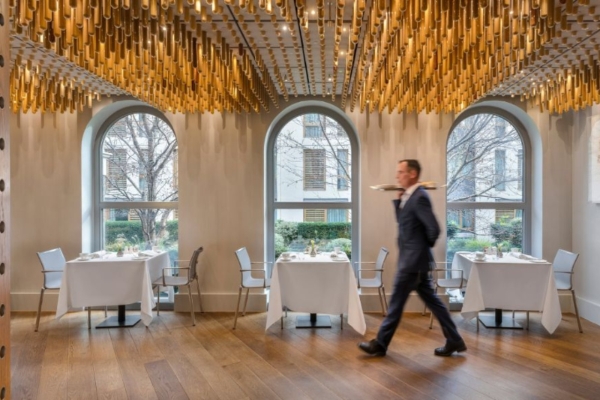 COMO The Halkin, London - a man walking in a restaurant