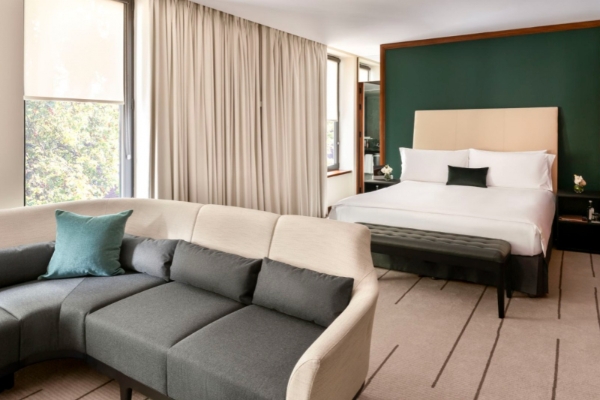 COMO The Halkin, London - a room with a couch and a bed