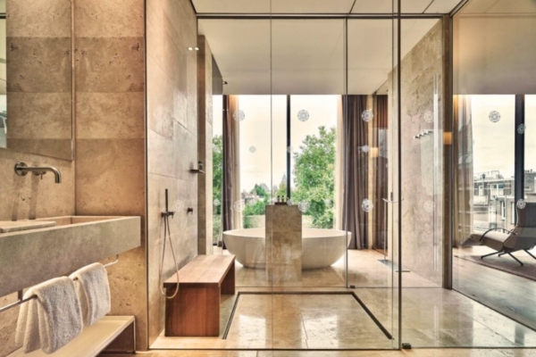 Conservatorium Hotel - a bathroom with a tub and shower