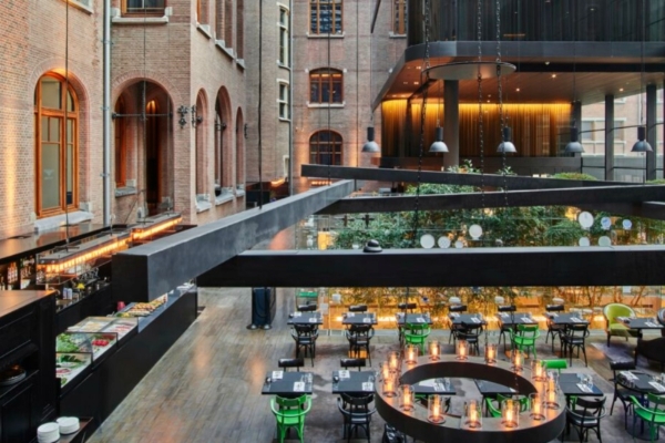 Conservatorium Hotel - a restaurant with tables and chairs