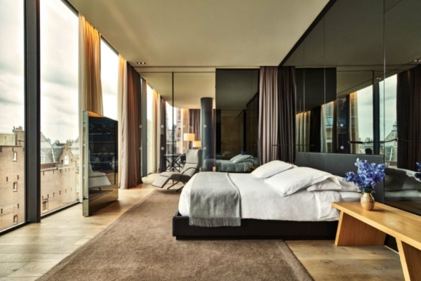 Conservatorium Hotel - a room with a bed and a television