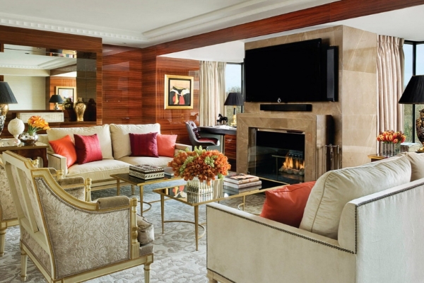 Four Seasons Hotel London at Park Lane - a living room with a fireplace and couches
