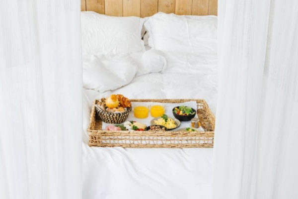 Hidden Hotel - a tray of food on a bed