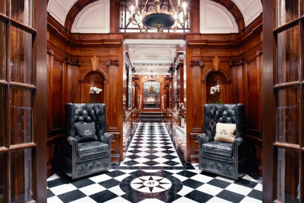 Hotel 41 - a black and white checkered floor with chairs