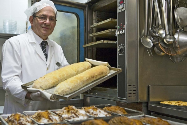 Hotel Artemide - Chef prepares freshly baked bread.