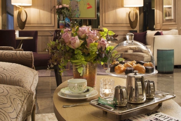 Hotel Balmoral - a table with a tray of food and flowers