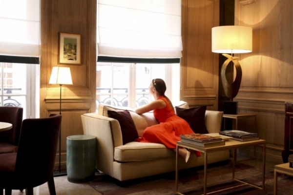 Hotel Balmoral - a woman sitting on a couch looking out a window