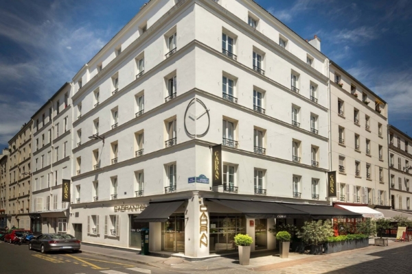 Hotel du Cadran - a building with a sign on the front