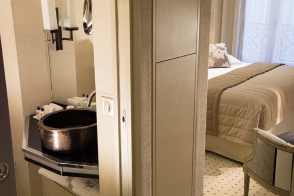 Hotel Madison - a bathroom with a sink and a bed