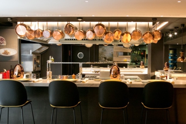 Hotel Ohla Barcelona - a kitchen with pots from the ceiling