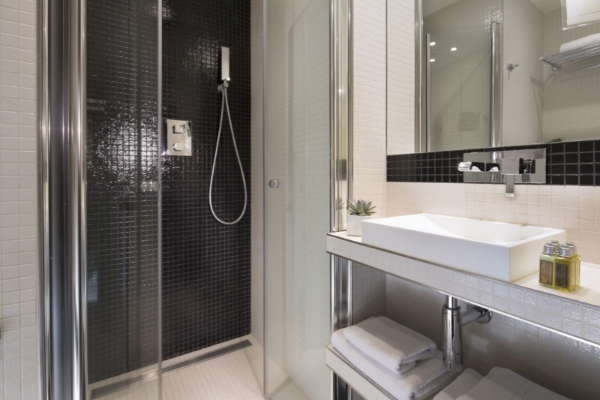 Hotel Signature St Germain des Pres - a bathroom with a shower and sink