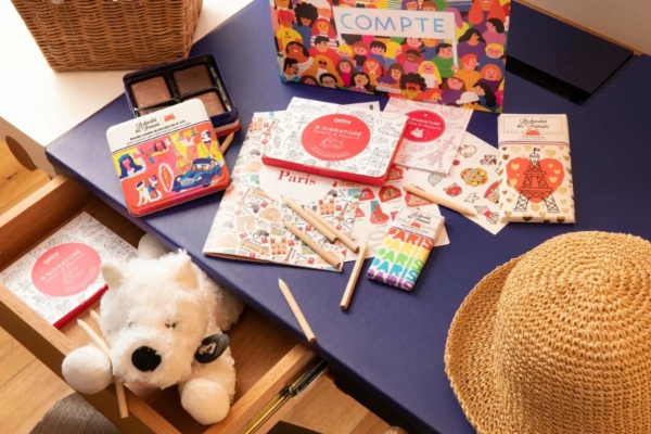 Hotel Vernet - a table with a book and a stuffed animal