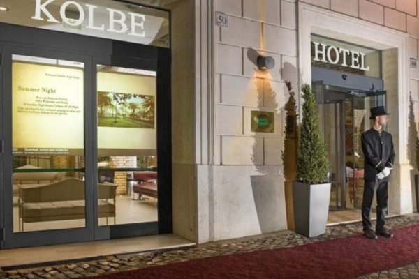 Kolbe Hotel Rome - A doorman standing at the entrance to the hotel.