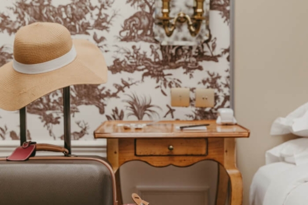 La Maison Favart - a suitcase and hat in a room