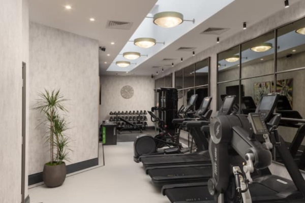 Lost Property St Paul's London - Curio Collection by Hilton - a room with treadmills and exercise equipment