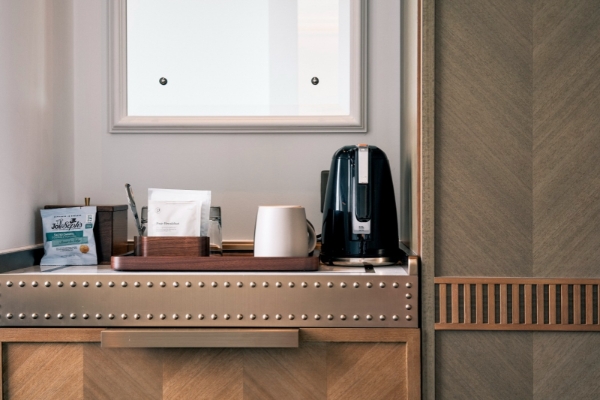 Page 8 - a coffee maker and a tray on a counter