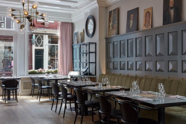 Pulitzer Amsterdam - a restaurant with tables and chairs