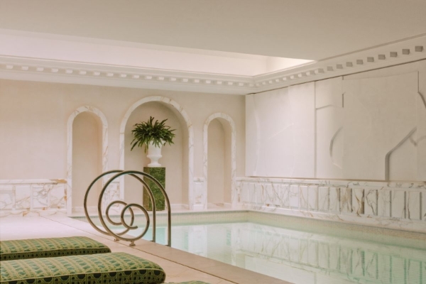 Saint James Paris - a indoor pool with a bench and a plant