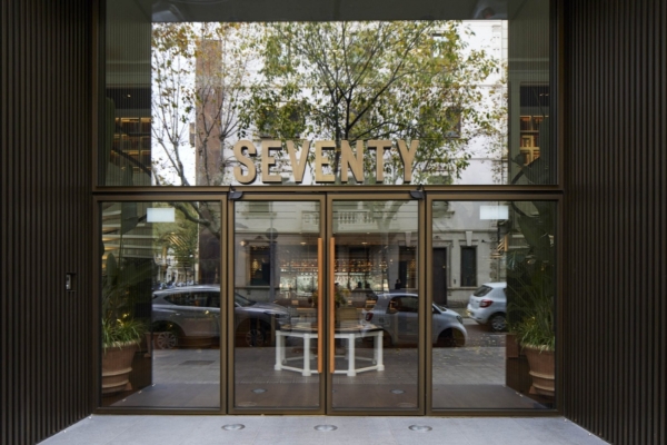 Seventy Barcelona - a glass door with a sign on it