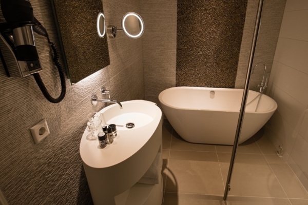 The Albus Hotel - a bathroom with a sink and tub